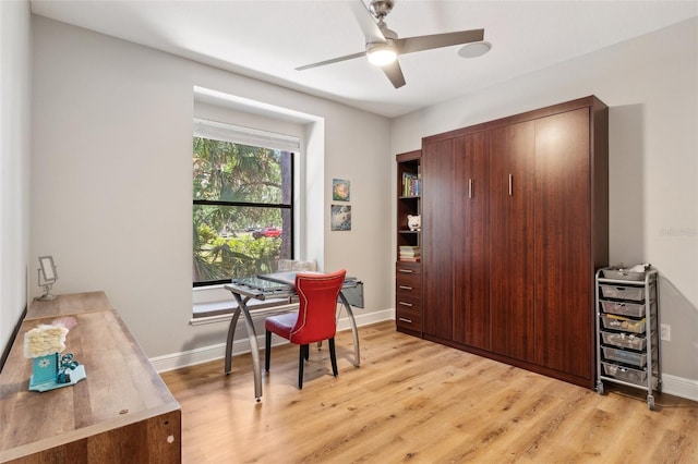 5850 Saddle Oak Trl, Sarasota, FL 34241 - home office with light wood-type flooring, a ceiling fan, and baseboards
