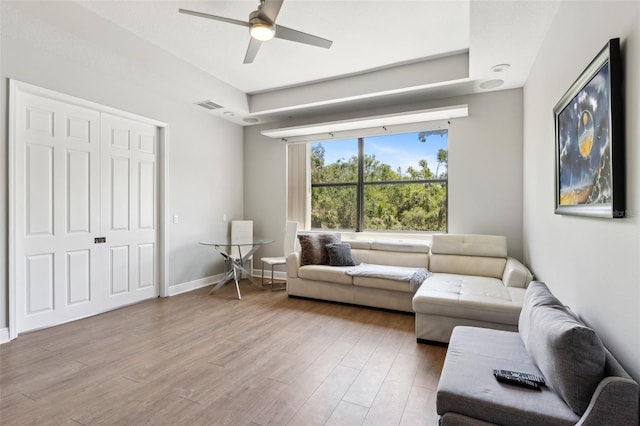 5850 Saddle Oak Trl, Sarasota, FL 34241 - living room featuring a ceiling fan, light wood finished floors, and baseboards