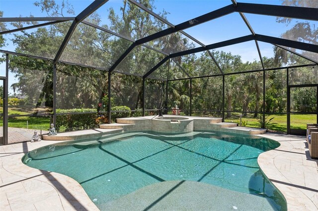 5850 Saddle Oak Trl, Sarasota, FL 34241 - view of swimming pool with a patio area, a lanai, and a pool with connected hot tub