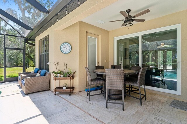 5850 Saddle Oak Trl, Sarasota, FL 34241 - sunroom / solarium with ceiling fan, a skylight, and outdoor dining area