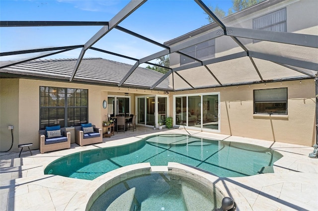 5850 Saddle Oak Trl, Sarasota, FL 34241 - view of pool featuring a pool with connected hot tub, a patio area, glass enclosure, and outdoor dining area