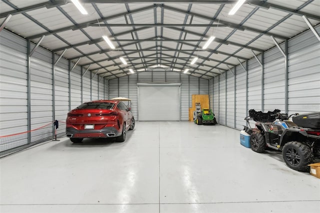 5850 Saddle Oak Trl, Sarasota, FL 34241 - garage featuring metal wall and a garage door opener