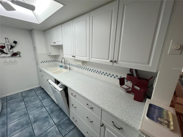 612 Bird Bay Dr S Unit 308, Venice, FL 34285 - clothes washing area featuring a sink and dark tile patterned floors