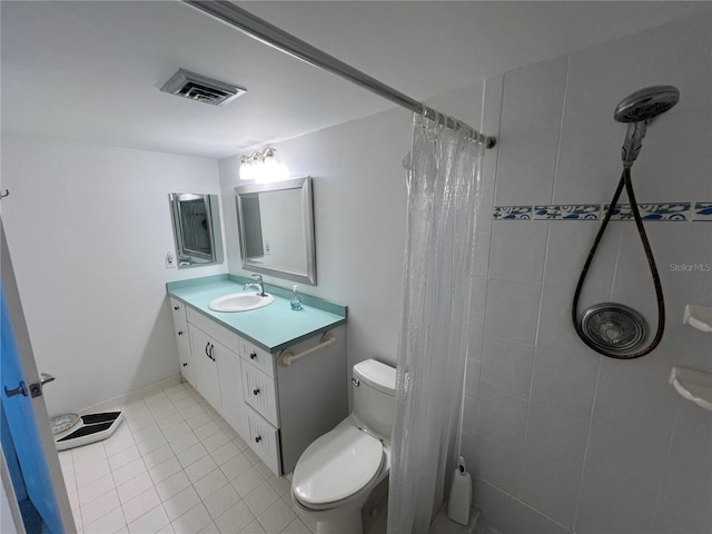 612 Bird Bay Dr S Unit 308, Venice, FL 34285 - full bath featuring toilet, tile patterned floors, tiled shower, and vanity