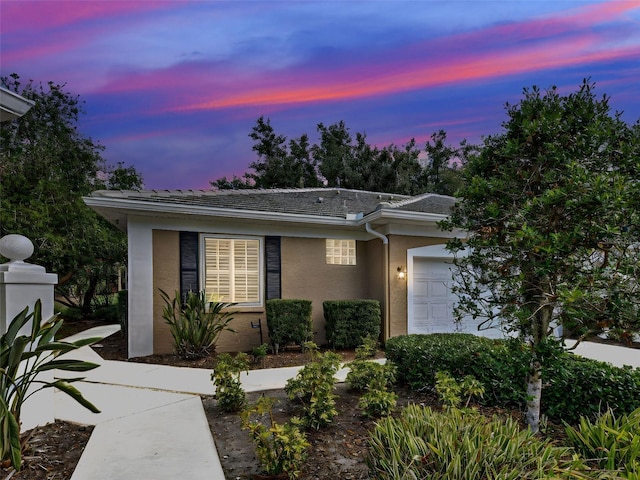 912 Barclay Ct, Venice, FL 34293 - ranch-style home featuring an attached garage and stucco siding