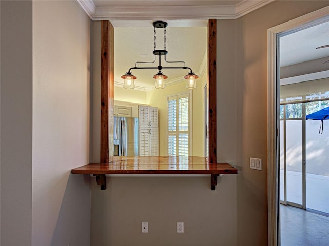 912 Barclay Ct, Venice, FL 34293 - detailed view of stainless steel refrigerator with ice dispenser and ornamental molding