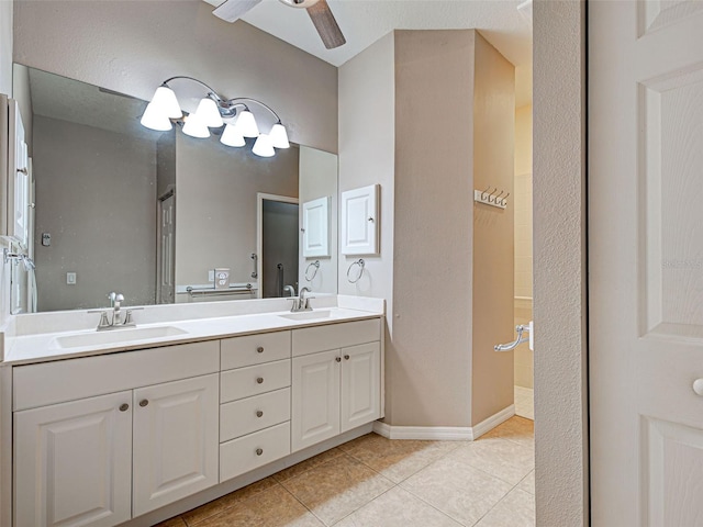 912 Barclay Ct, Venice, FL 34293 - bathroom with double vanity, tile patterned floors, a ceiling fan, a shower, and baseboards