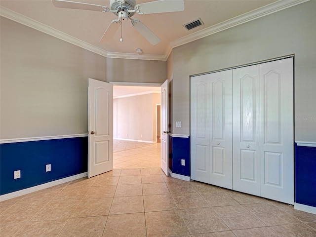 912 Barclay Ct, Venice, FL 34293 - unfurnished bedroom with ornamental molding, light tile patterned flooring, baseboards, a closet, and ceiling fan