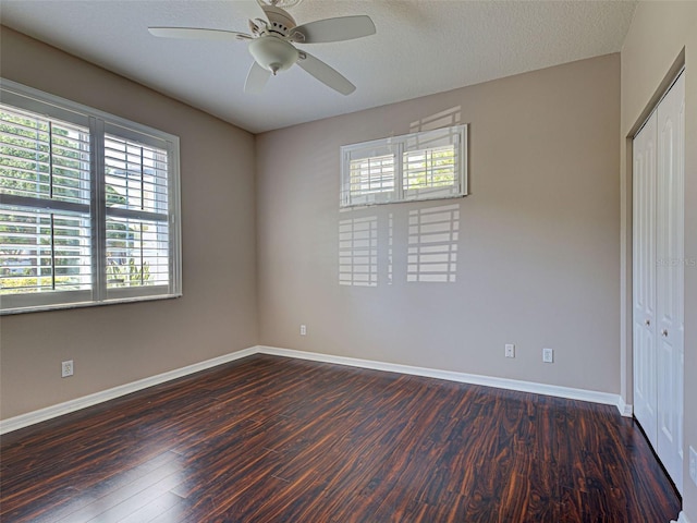 912 Barclay Ct, Venice, FL 34293 - unfurnished bedroom with a closet, wood finished floors, baseboards, and a ceiling fan