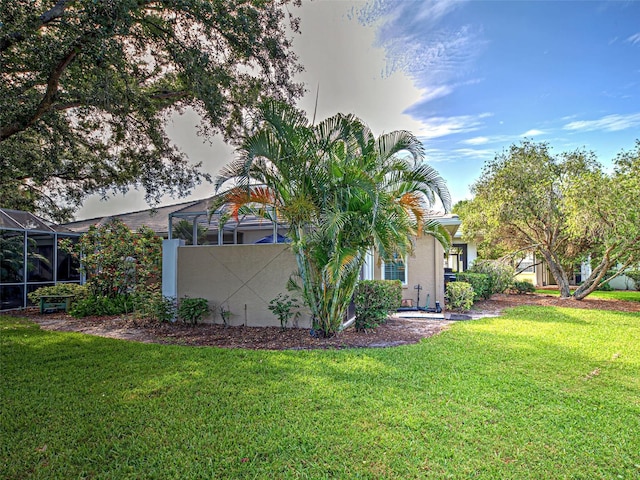 912 Barclay Ct, Venice, FL 34293 - view of green lawn featuring a lanai