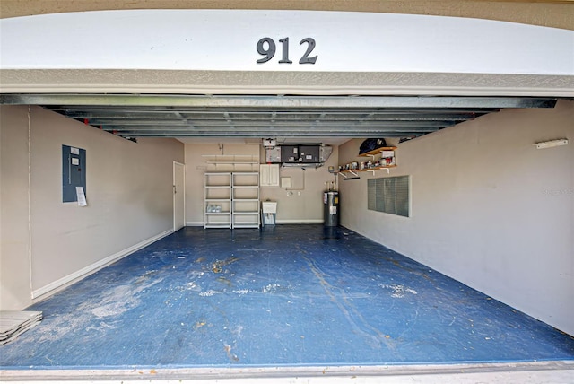 912 Barclay Ct, Venice, FL 34293 - garage with electric water heater, electric panel, and a sink