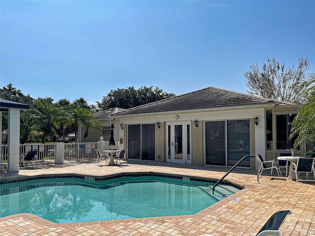 912 Barclay Ct, Venice, FL 34293 - community pool with a patio area and french doors