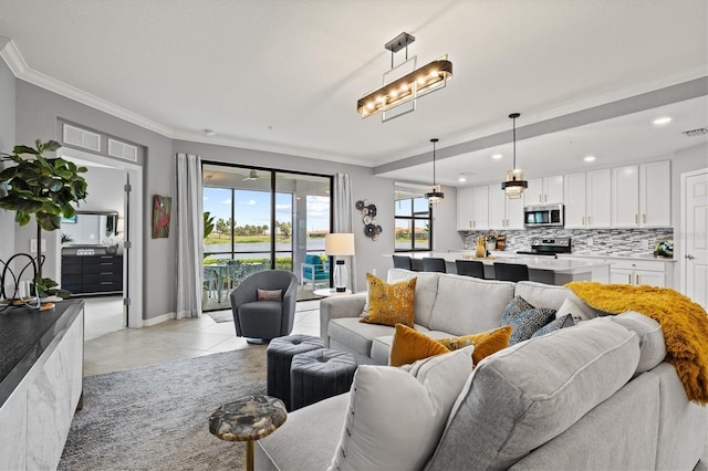 10808 Tarflower Dr Unit 102, Venice, FL 34293 - living area featuring crown molding, light tile patterned floors, recessed lighting, and baseboards
