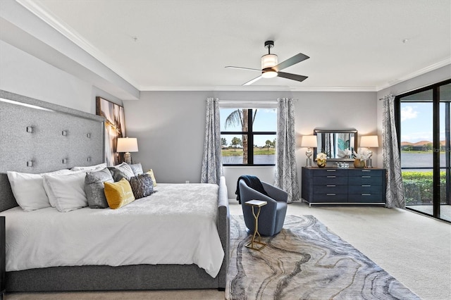 10808 Tarflower Dr Unit 102, Venice, FL 34293 - bedroom with ornamental molding, light carpet, access to exterior, a ceiling fan, and a water view