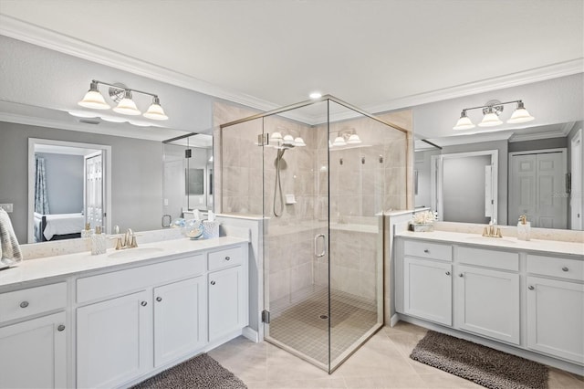 10808 Tarflower Dr Unit 102, Venice, FL 34293 - bathroom with ornamental molding, ensuite bath, a shower stall, two vanities, and tile patterned flooring