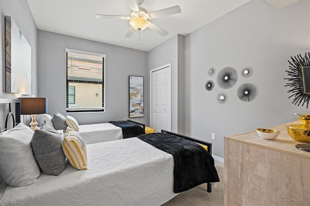 10808 Tarflower Dr Unit 102, Venice, FL 34293 - carpeted bedroom with baseboards, a closet, and a ceiling fan