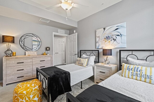 10808 Tarflower Dr Unit 102, Venice, FL 34293 - bedroom with light colored carpet and a ceiling fan