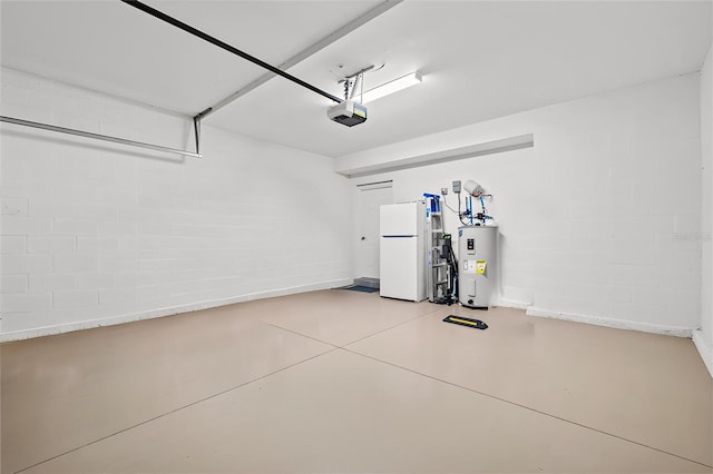 10808 Tarflower Dr Unit 102, Venice, FL 34293 - garage with water heater, freestanding refrigerator, a garage door opener, and concrete block wall