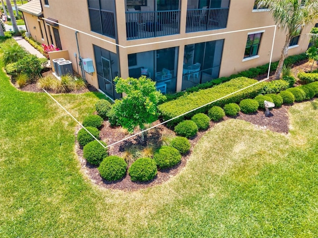 10808 Tarflower Dr Unit 102, Venice, FL 34293 - view of green lawn featuring central AC unit