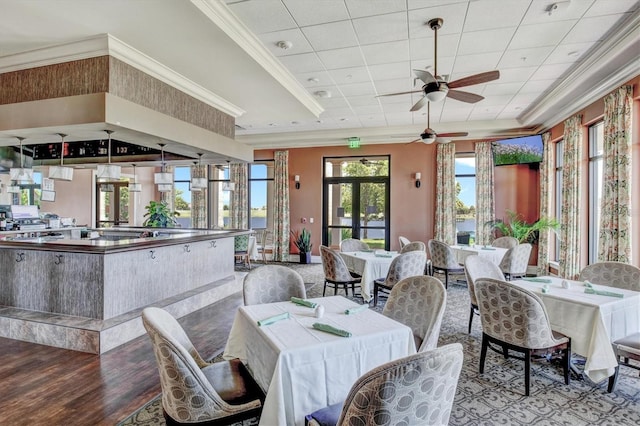 10808 Tarflower Dr Unit 102, Venice, FL 34293 - dining space with a ceiling fan, wood finished floors, crown molding, and a drop ceiling