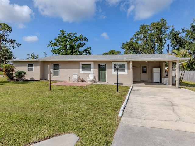 4192 Tarpon Rd, Venice, FL 34293 - ranch-style home with stucco siding, driveway, and a carport