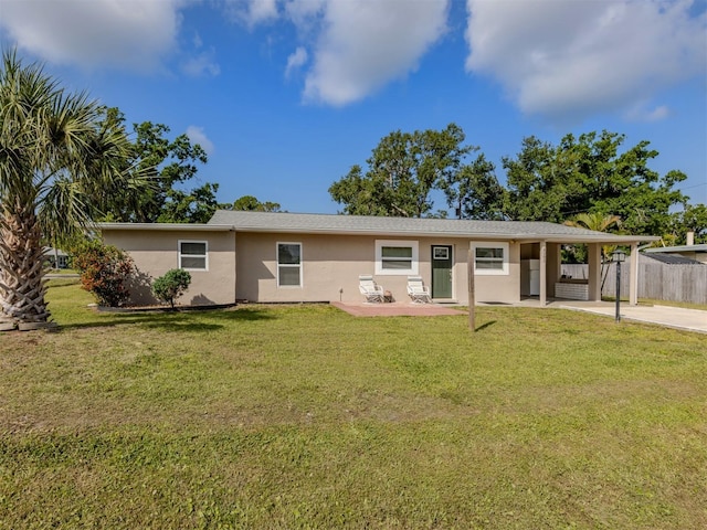 4192 Tarpon Rd, Venice, FL 34293 - view of front of home with stucco siding, concrete driveway, an attached carport, and a patio area