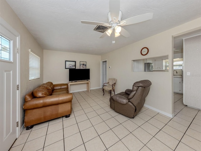 4192 Tarpon Rd, Venice, FL 34293 - living room featuring light tile patterned flooring and a ceiling fan