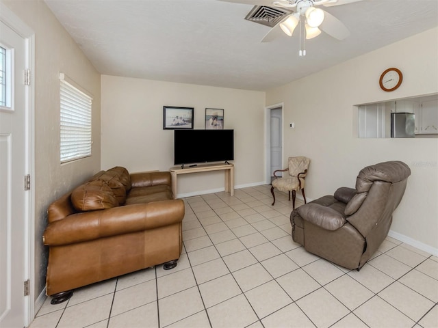 4192 Tarpon Rd, Venice, FL 34293 - living area with light tile patterned floors, ceiling fan, and baseboards