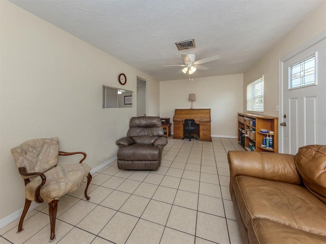 4192 Tarpon Rd, Venice, FL 34293 - living room with light tile patterned flooring, ceiling fan, and baseboards