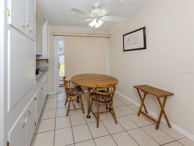 4192 Tarpon Rd, Venice, FL 34293 - dining area featuring a ceiling fan, baseboards, and light tile patterned floors