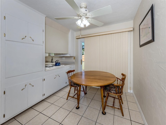4192 Tarpon Rd, Venice, FL 34293 - dining space featuring ceiling fan, light tile patterned floors, and baseboards