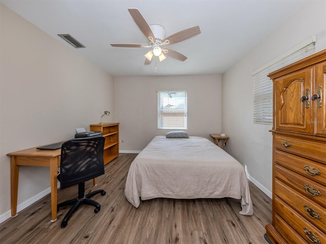 4192 Tarpon Rd, Venice, FL 34293 - bedroom featuring wood finished floors, baseboards, ceiling fan, and a desk