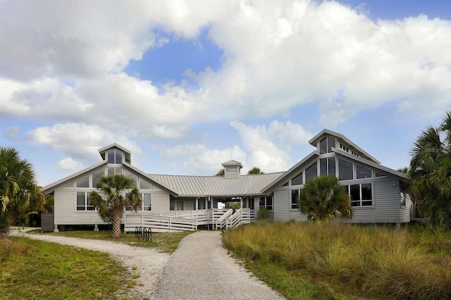 4192 Tarpon Rd, Venice, FL 34293 - view of front of home featuring metal roof and a chimney