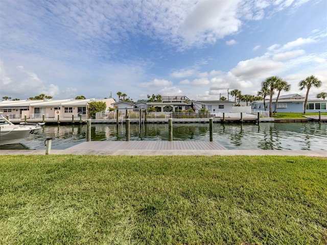 832 Whitecap Cir Unit 5, Venice, FL 34285 - dock area featuring a residential view, a lawn, and a water view