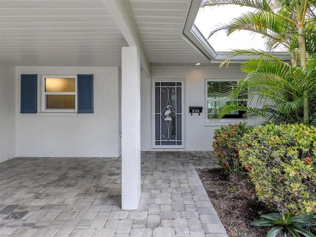 832 Whitecap Cir Unit 5, Venice, FL 34285 - view of exterior entry with stucco siding