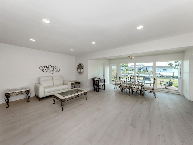 832 Whitecap Cir Unit 5, Venice, FL 34285 - living room with baseboards, light wood-style flooring, and recessed lighting