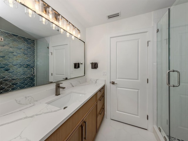 832 Whitecap Cir Unit 5, Venice, FL 34285 - full bath with a shower stall, vanity, and tile patterned floors