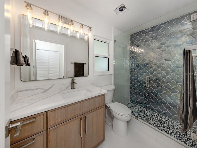 832 Whitecap Cir Unit 5, Venice, FL 34285 - full bathroom featuring tiled shower, toilet, vanity, and tile patterned floors