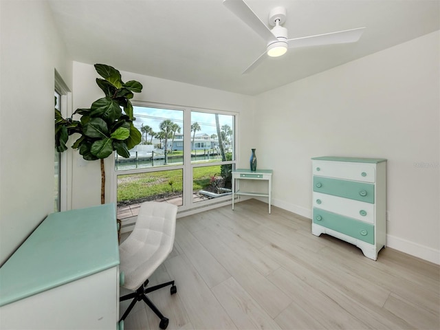 832 Whitecap Cir Unit 5, Venice, FL 34285 - office with baseboards, light wood-type flooring, and a ceiling fan