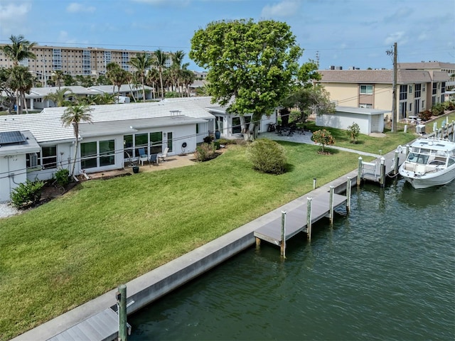 832 Whitecap Cir Unit 5, Venice, FL 34285 - back of property featuring a water view, a yard, and stucco siding