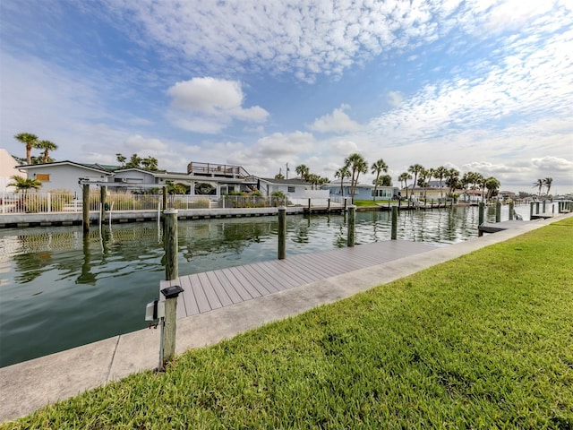 832 Whitecap Cir Unit 5, Venice, FL 34285 - dock with a water view, a yard, and a residential view