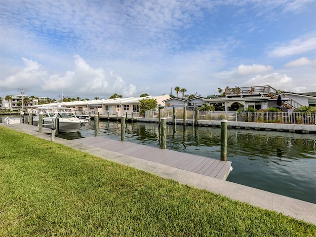 832 Whitecap Cir Unit 5, Venice, FL 34285 - dock area with a water view and a lawn
