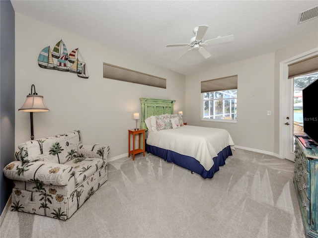 463 Park Trace Blvd, Osprey, FL 34229 - carpeted bedroom with baseboards, multiple windows, and a ceiling fan