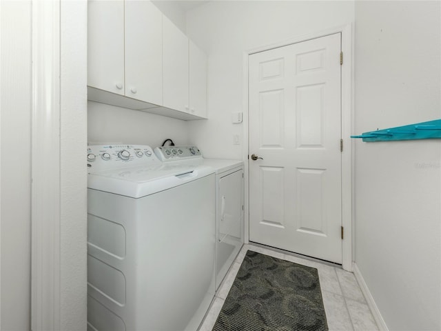 463 Park Trace Blvd, Osprey, FL 34229 - washroom with separate washer and dryer, cabinet space, and baseboards