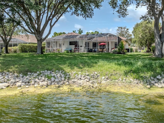 463 Park Trace Blvd, Osprey, FL 34229 - rear view of house with a water view, a lawn, and a lanai