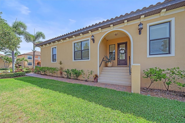 9220 43rd Ter W, Bradenton, FL 34209 - view of front of house featuring stucco siding, a front lawn, and covered porch