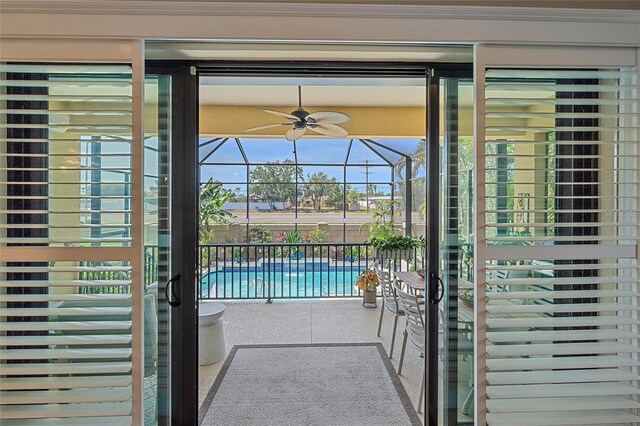 9220 43rd Ter W, Bradenton, FL 34209 - doorway to outside with a sunroom and ceiling fan