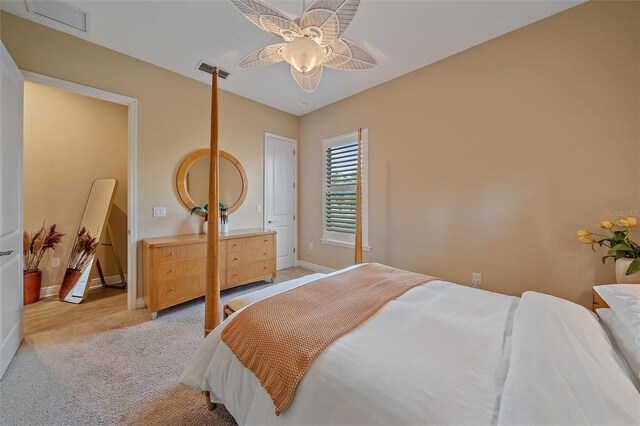 9220 43rd Ter W, Bradenton, FL 34209 - bedroom featuring light carpet, baseboards, and ceiling fan