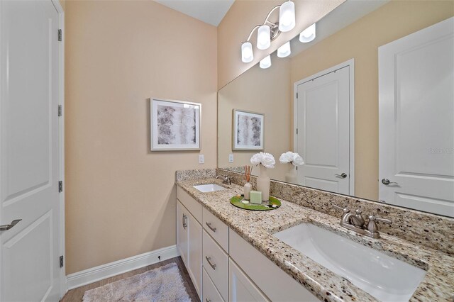 9220 43rd Ter W, Bradenton, FL 34209 - full bathroom featuring double vanity and baseboards