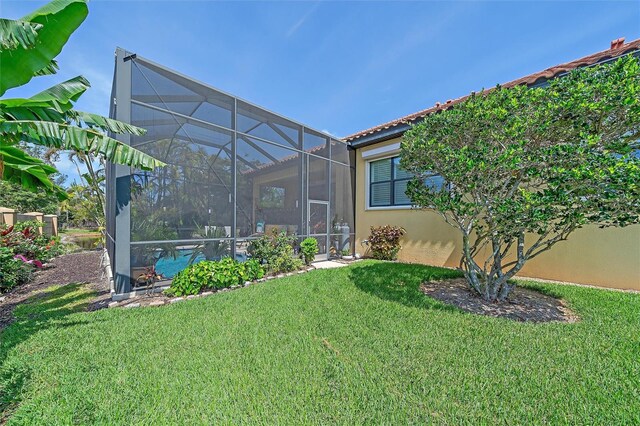 9220 43rd Ter W, Bradenton, FL 34209 - view of grassy yard with a lanai